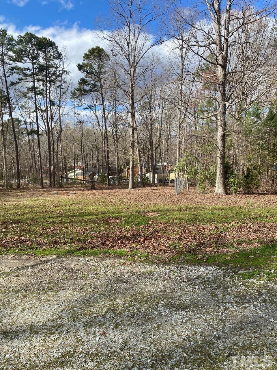 519 Goodwin Road Durham, NC 27712 - Photo 5 of 18 a view of a field with trees