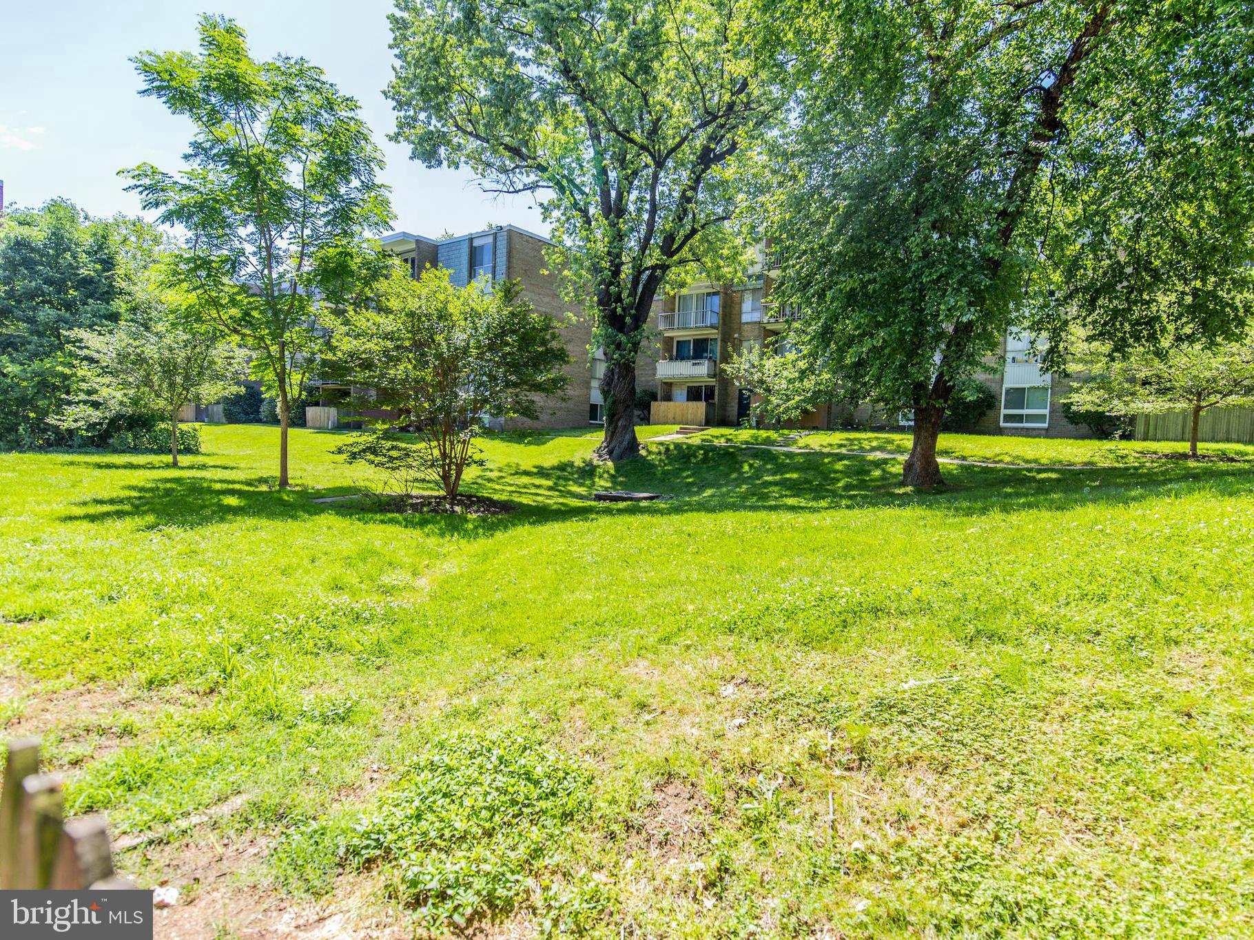 3934 Bel Pre Road, Unit 39342 Silver Spring, MD 20906 - Photo 30 of 30 a view of a park with large trees