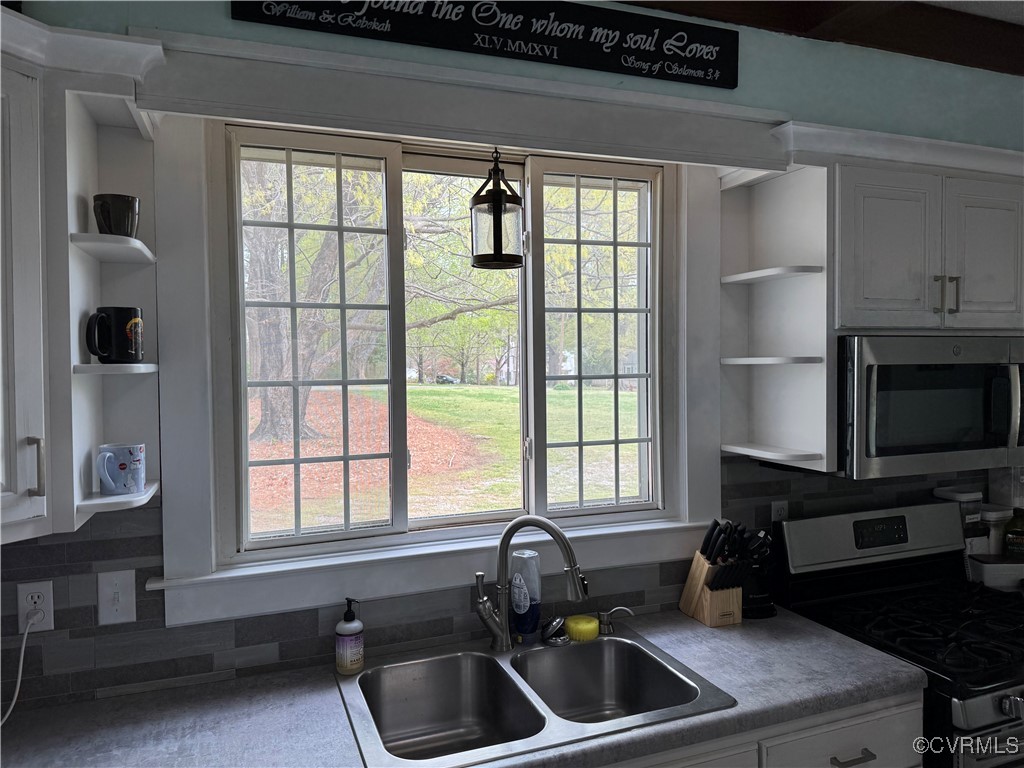 301 Harris Spring Road Burkeville, VA 23922 - Photo 8 of 33 Kitchen with open shelves, a sink, light counterto