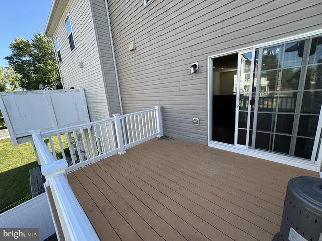 a large kitchen with kitchen island granite countertop a large counter top stainless steel appliances and cabinets