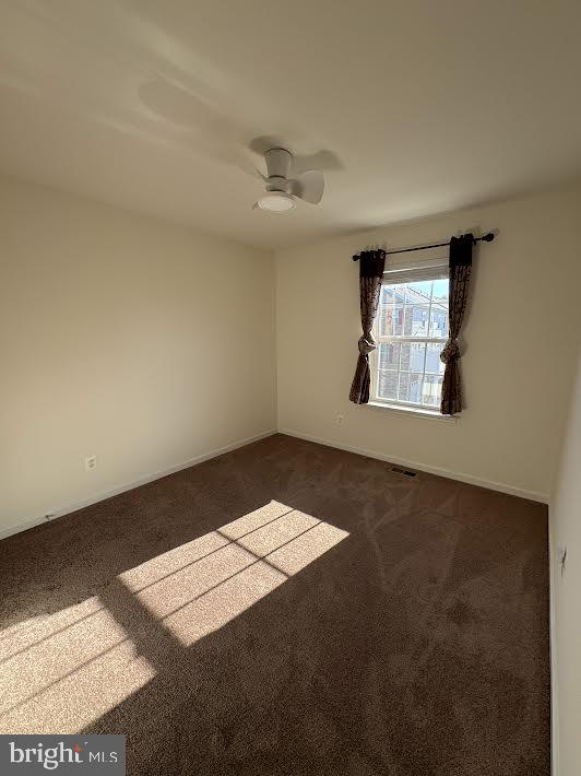 7806 Taggart Court Elkridge, MD 21075 - Photo 17 of 21 an empty room with windows and ceiling fan