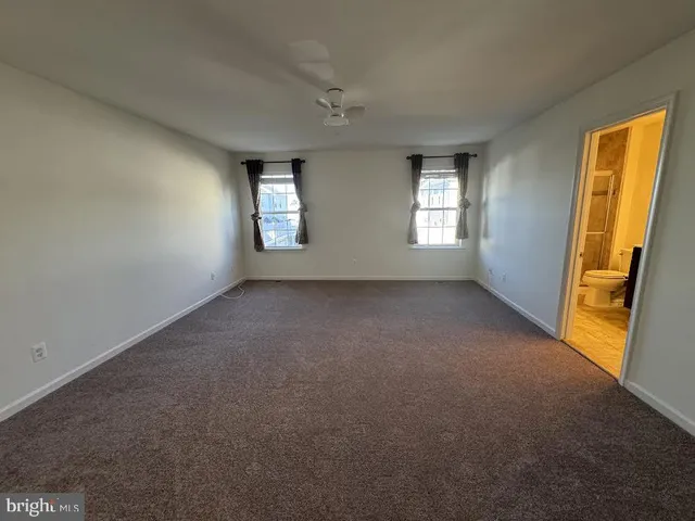 a bathroom with a double vanity sink toilet and shower