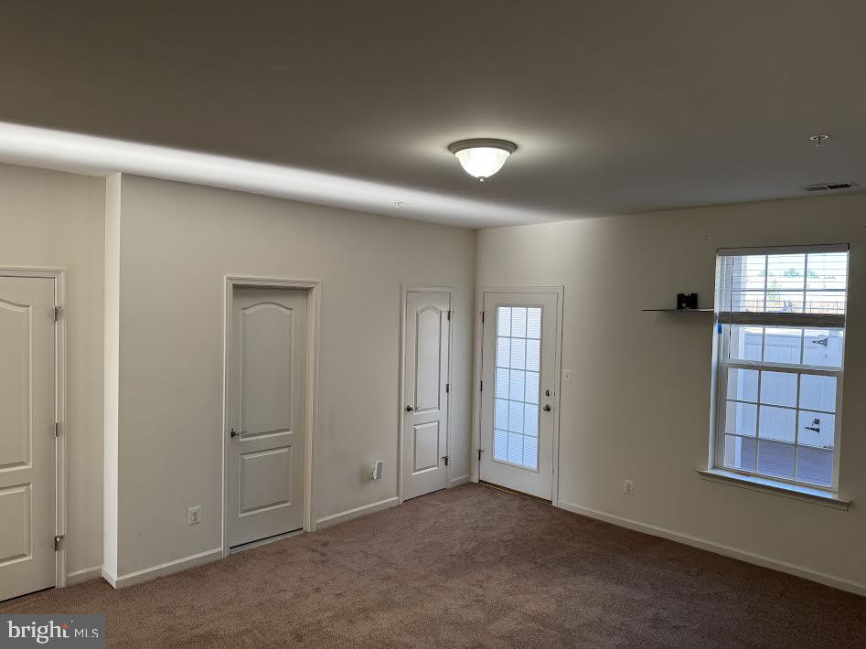 7806 Taggart Court Elkridge, MD 21075 - Photo 6 of 21 an empty room with windows and cabinet