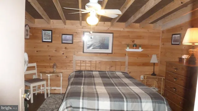 a bedroom with a bed and a mirror