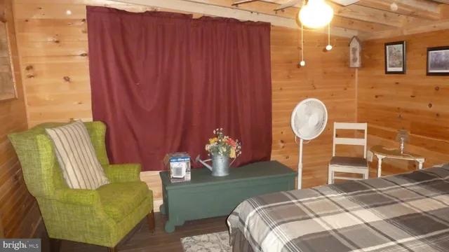 a bedroom with a bed and chandelier