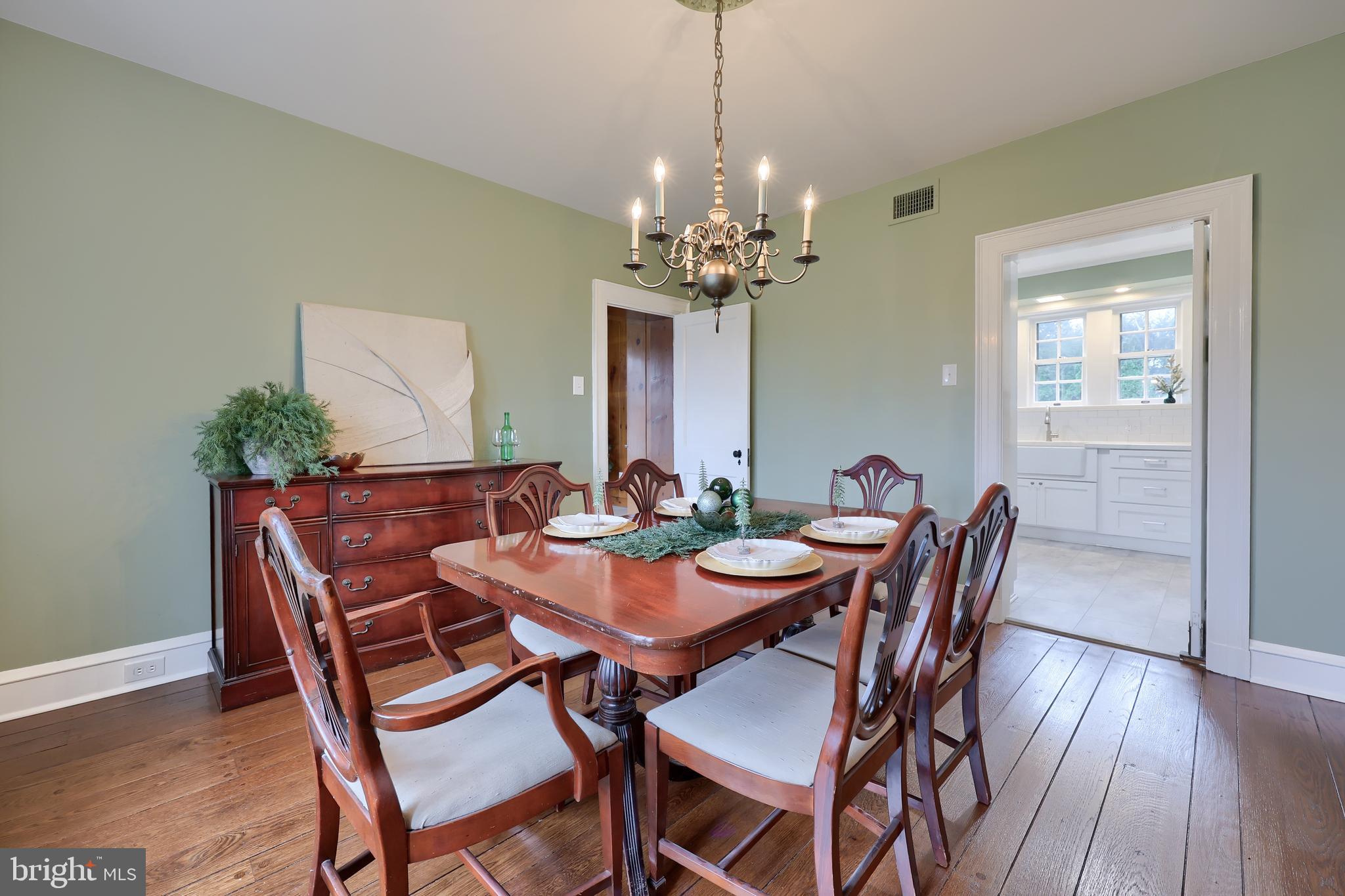 568 Chestnut Street Columbia, PA 17512 - Photo 12 of 68 a view of a dining room with furniture window and wooden floor