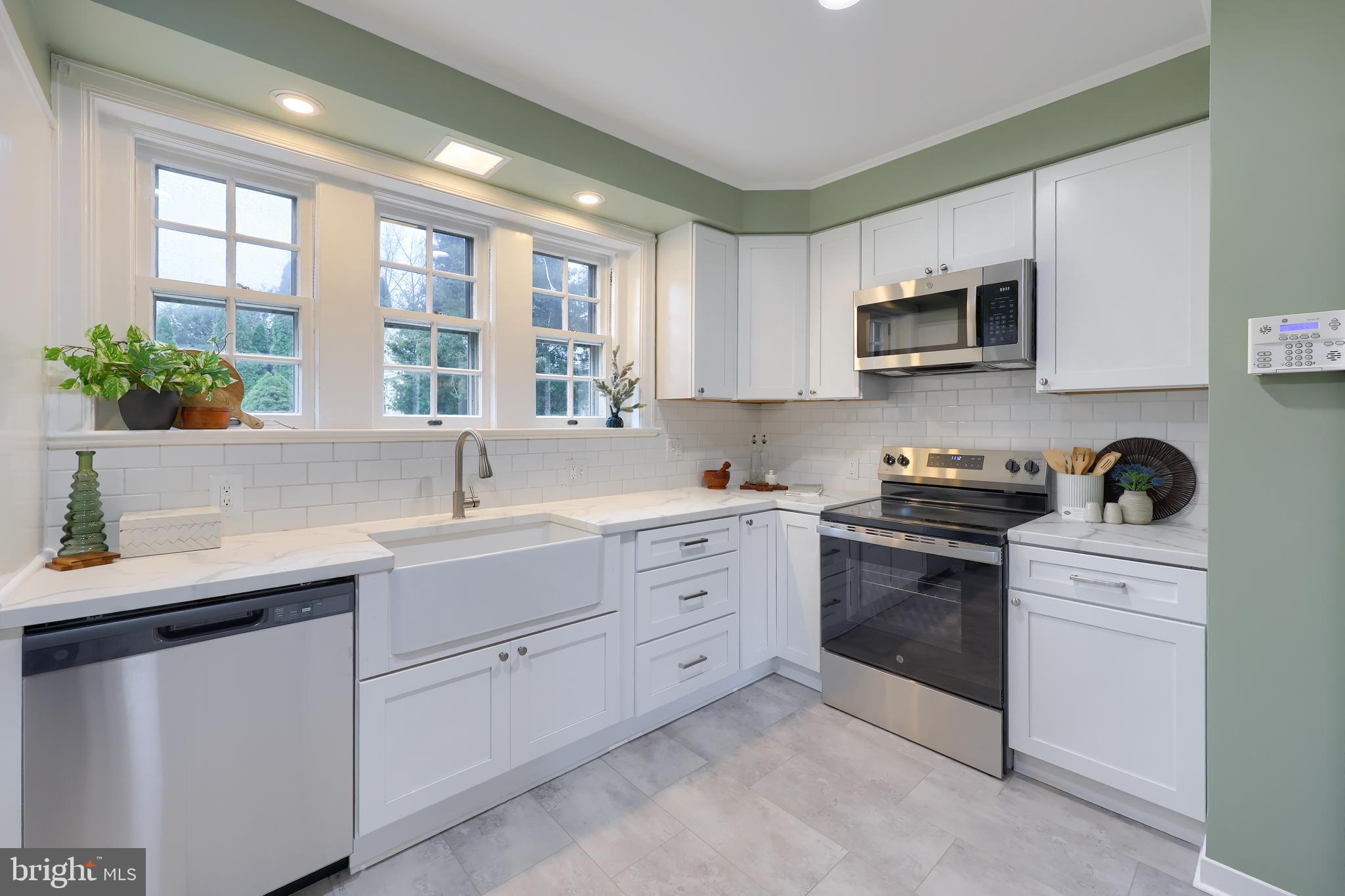 568 Chestnut Street Columbia, PA 17512 - Photo 18 of 68 a kitchen with white cabinets and appliances