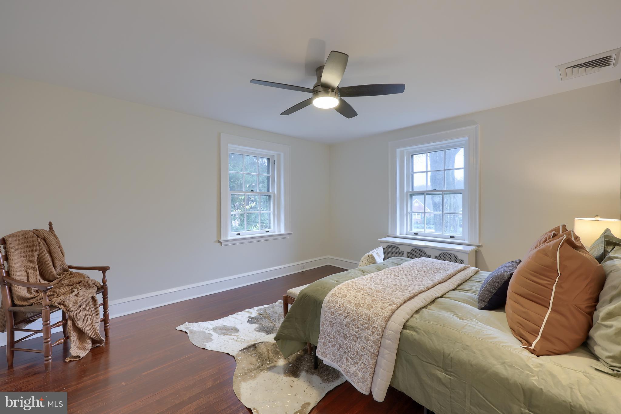 568 Chestnut Street Columbia, PA 17512 - Photo 32 of 68 a bedroom with a bed and wooden floor