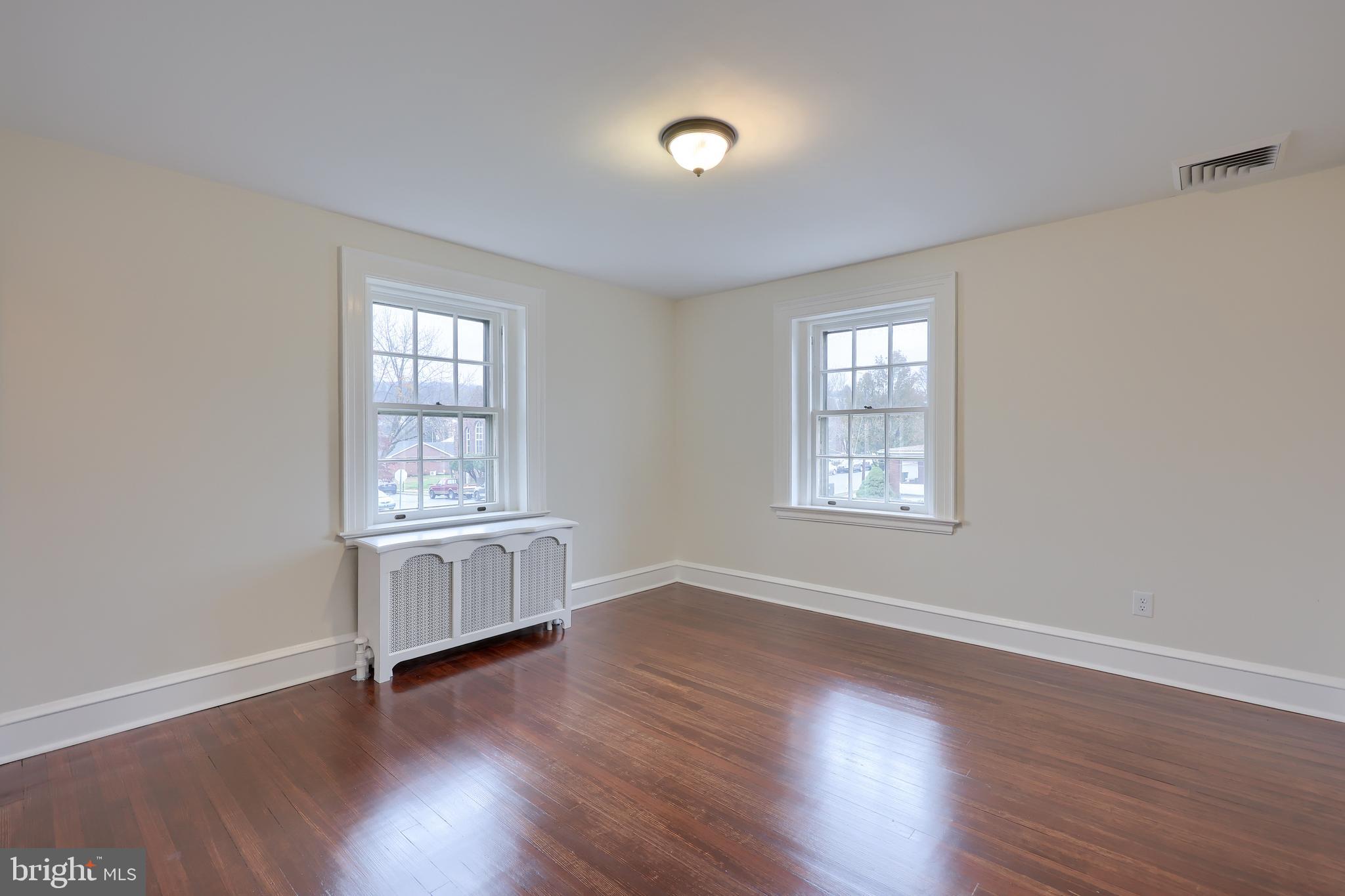 568 Chestnut Street Columbia, PA 17512 - Photo 38 of 68 wooden floor in an empty room with a window