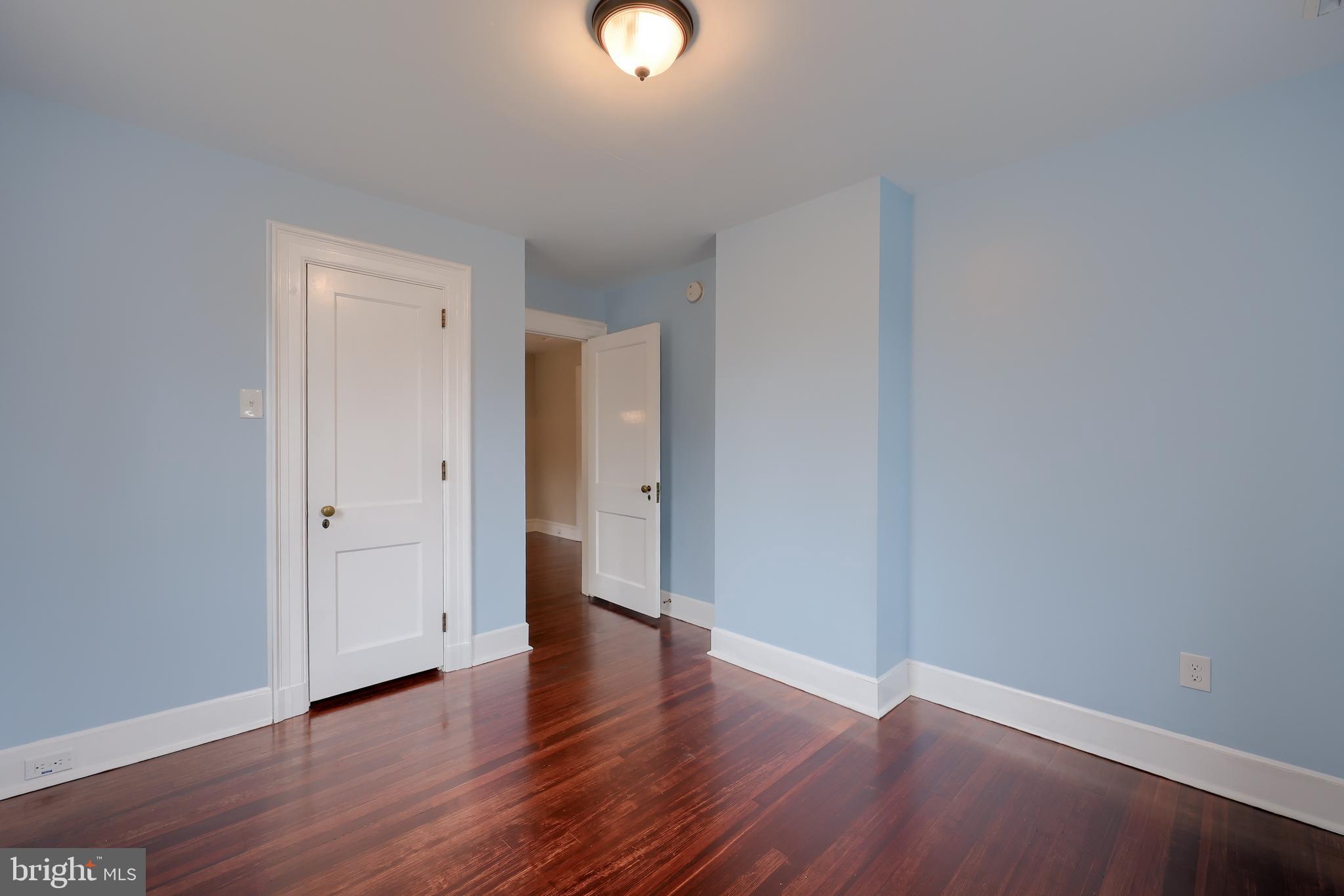568 Chestnut Street Columbia, PA 17512 - Photo 39 of 68 a view of an empty room with wooden floor
