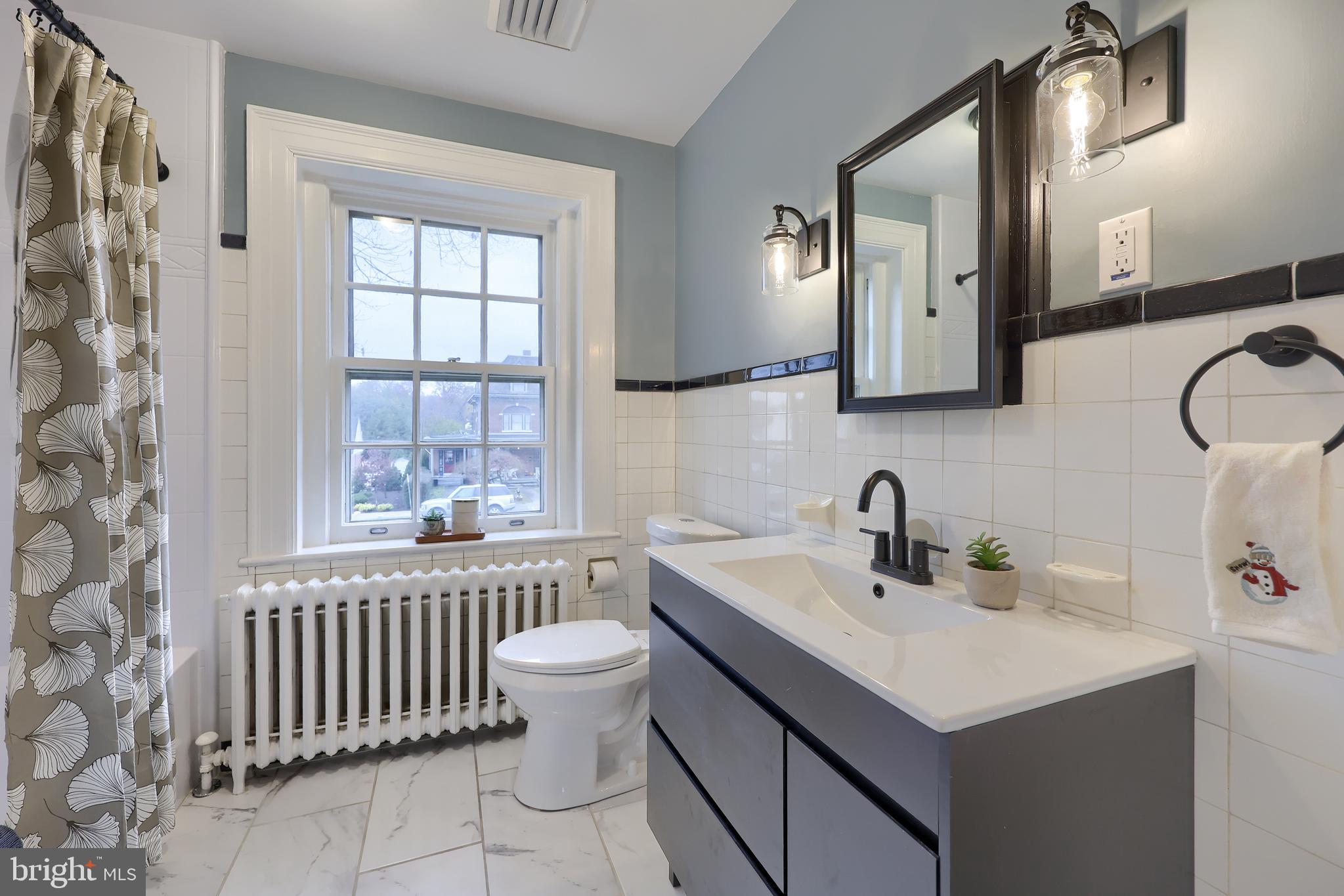 568 Chestnut Street Columbia, PA 17512 - Photo 41 of 68 a bathroom with a sink and a mirror