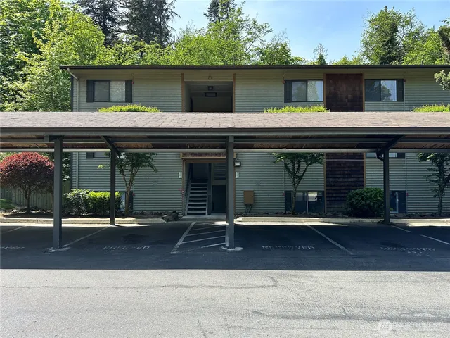front view of a house with a bench
