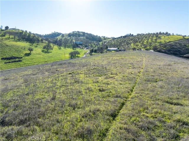 a view of a mountain with a yard and mountain view