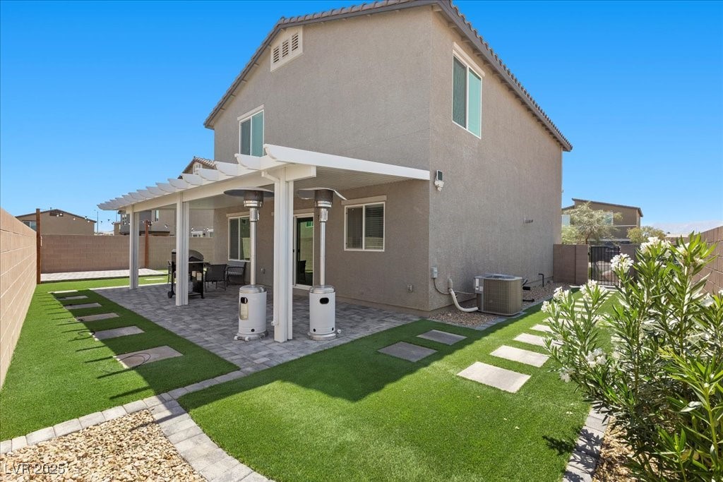 9054 Tangerine Tree Court Las Vegas, NV 89113 - Photo 28 of 50 Back of house featuring a fenced backyard, stucco siding, and a pergola