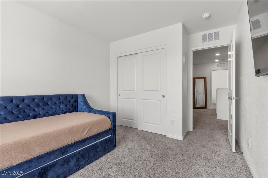 9054 Tangerine Tree Court Las Vegas, NV 89113 - Photo 34 of 50 Bedroom featuring carpet and a closet