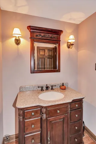 a bedroom with a bed and a fireplace