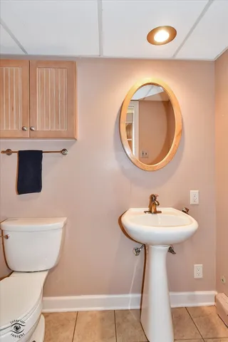 a spacious bedroom with a bed and a fireplace