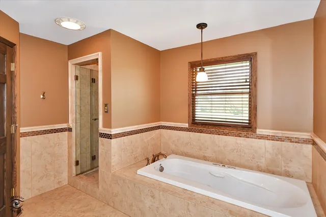 a bathroom with a granite countertop sink a mirror and a toilet