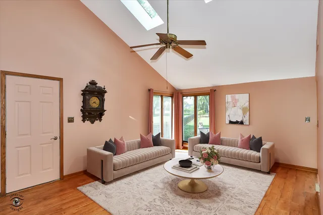 a kitchen with a sink a refrigerator and cabinets