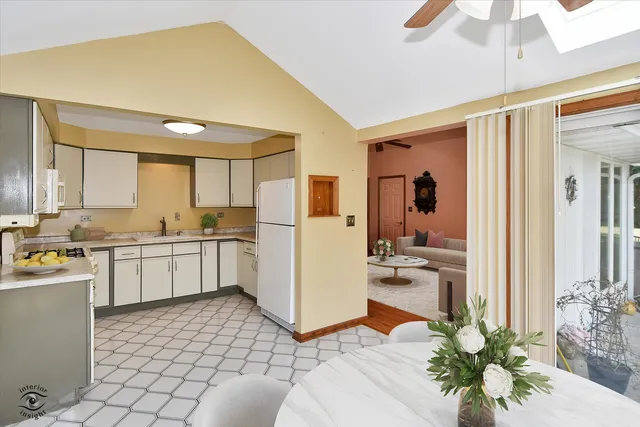 a bedroom with furniture and a flat screen tv