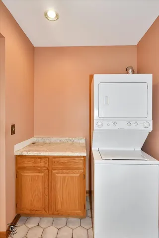 a view of a field with of trees in front of it