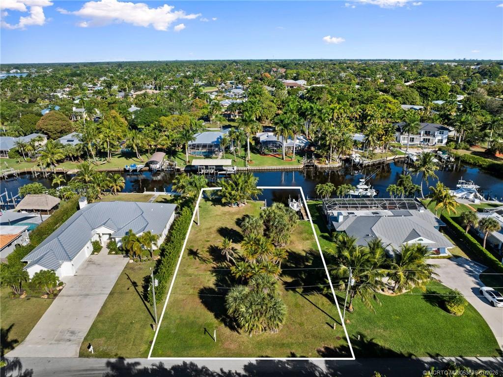 1706 Northwest Fork Road Stuart, FL 34994 - Photo 6 of 11 an aerial view of residential houses with outdoor space