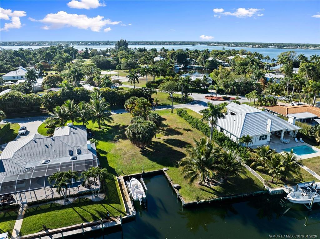 1706 Northwest Fork Road Stuart, FL 34994 - Photo 10 of 11 an aerial view of residential houses with outdoor space and swimming pool