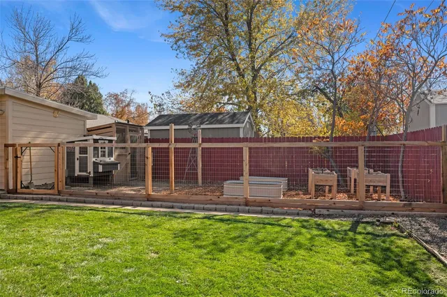 a view of a chair and table in the garden