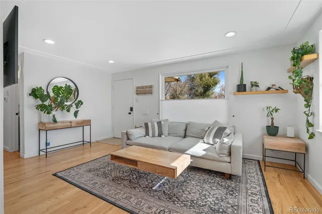 a living room with furniture and a rug