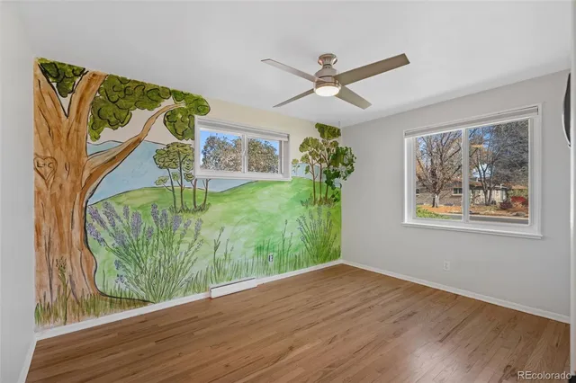 wooden floor in a hall with a window