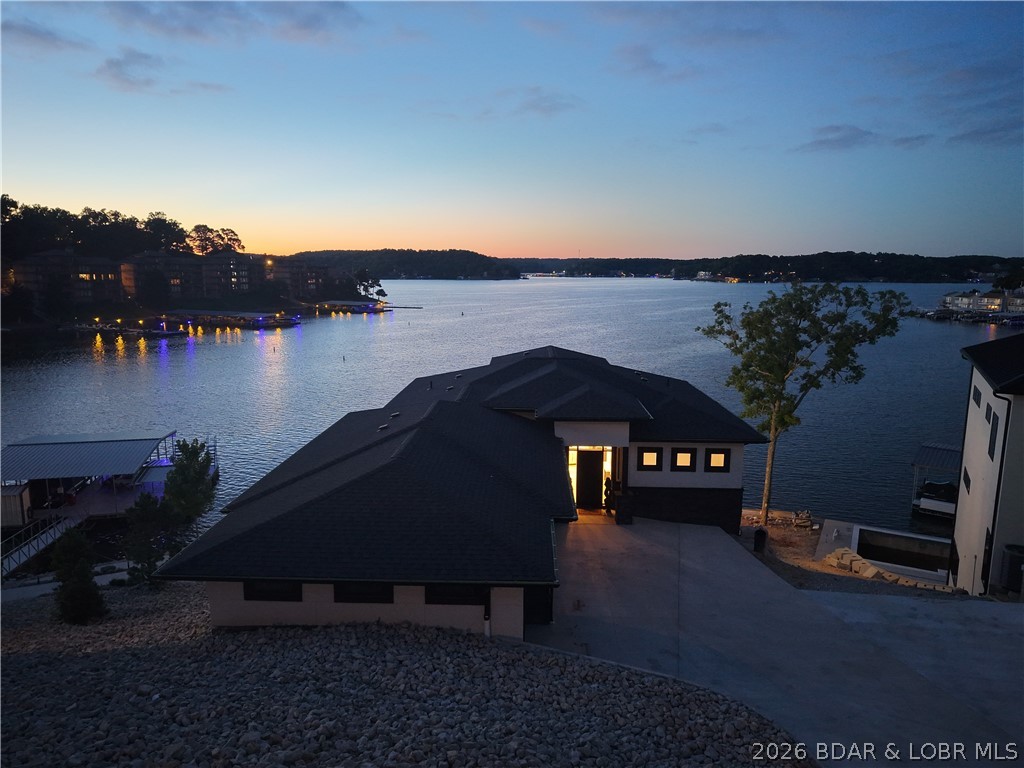 439 Red Bud Road Lake Ozark, MO 65049 - Photo 7 of 98 Evening aerial showcasing the beautifully illumina