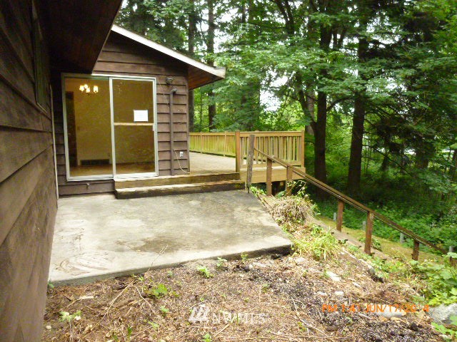 1618 194th Street Southeast Bothell, WA 98012 - Photo 2 of 20 a backyard of a house with table and chairs