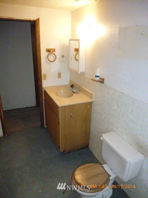 1618 194th Street Southeast Bothell, WA 98012 - Photo 16 of 20 a bathroom with a sink a toilet and mirror