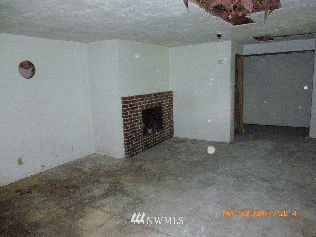 1618 194th Street Southeast Bothell, WA 98012 - Photo 19 of 20 a view of an empty room with a fireplace