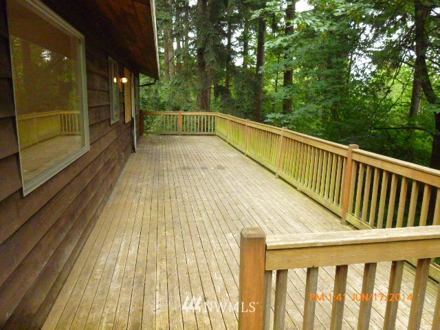 1618 194th Street Southeast Bothell, WA 98012 - Photo 3 of 20 a view of balcony with wooden floor and fence