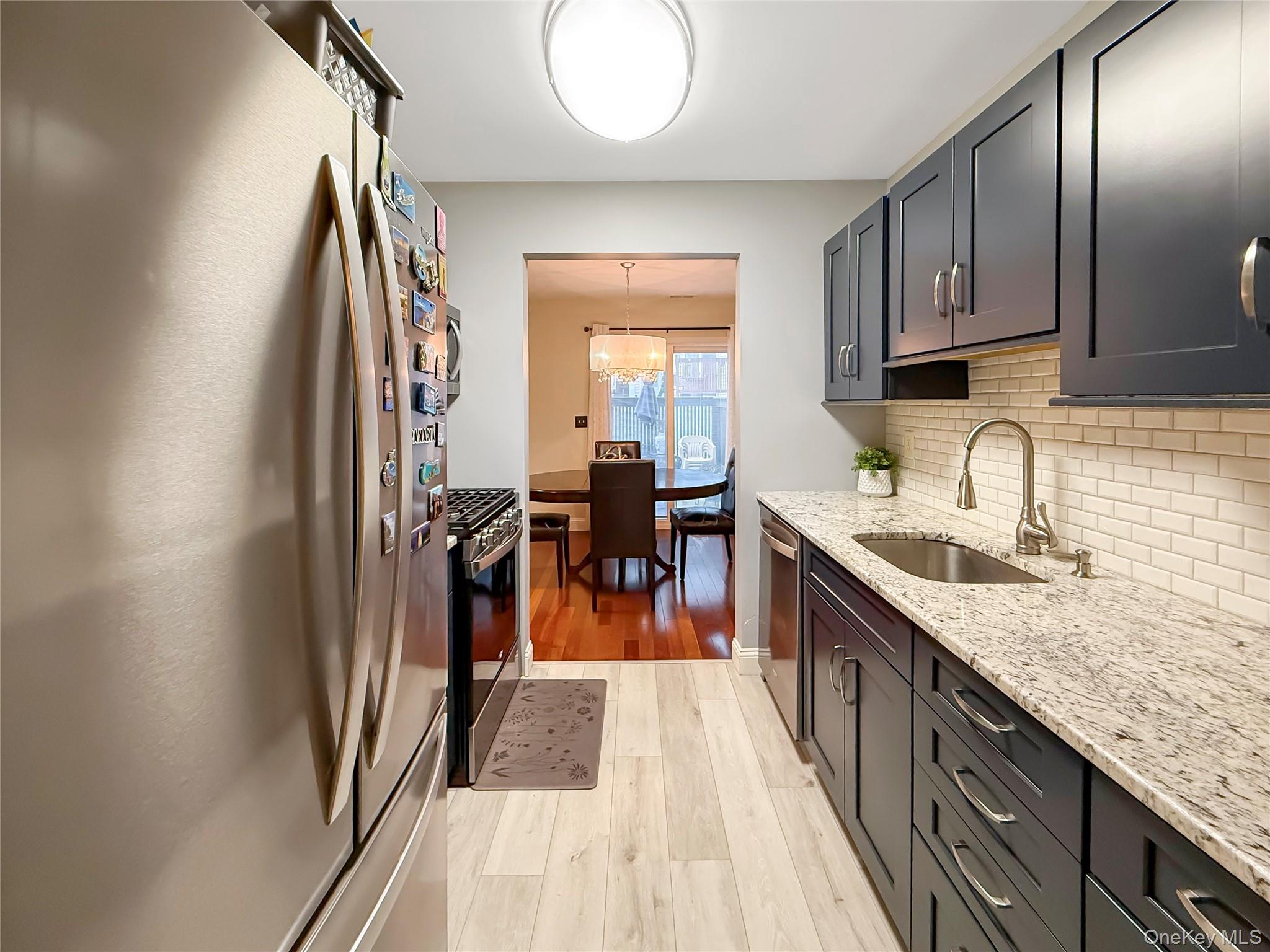 4508 Whispering Hills Road Chester, NY 10918 - Photo 11 of 20 a kitchen with stainless steel appliances granite countertop a refrigerator and a sink