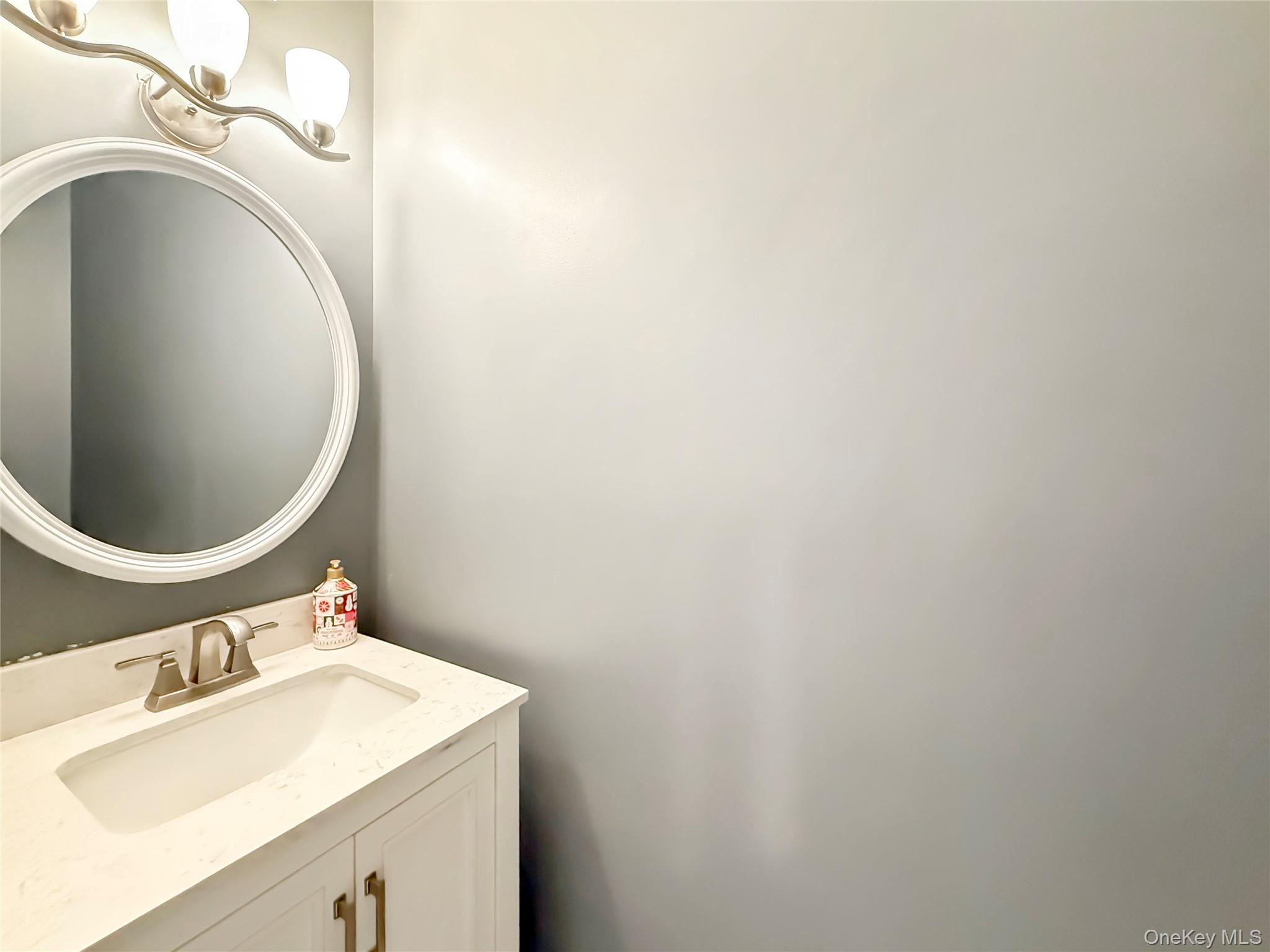 4508 Whispering Hills Road Chester, NY 10918 - Photo 12 of 20 a bathroom with a sink and a mirror