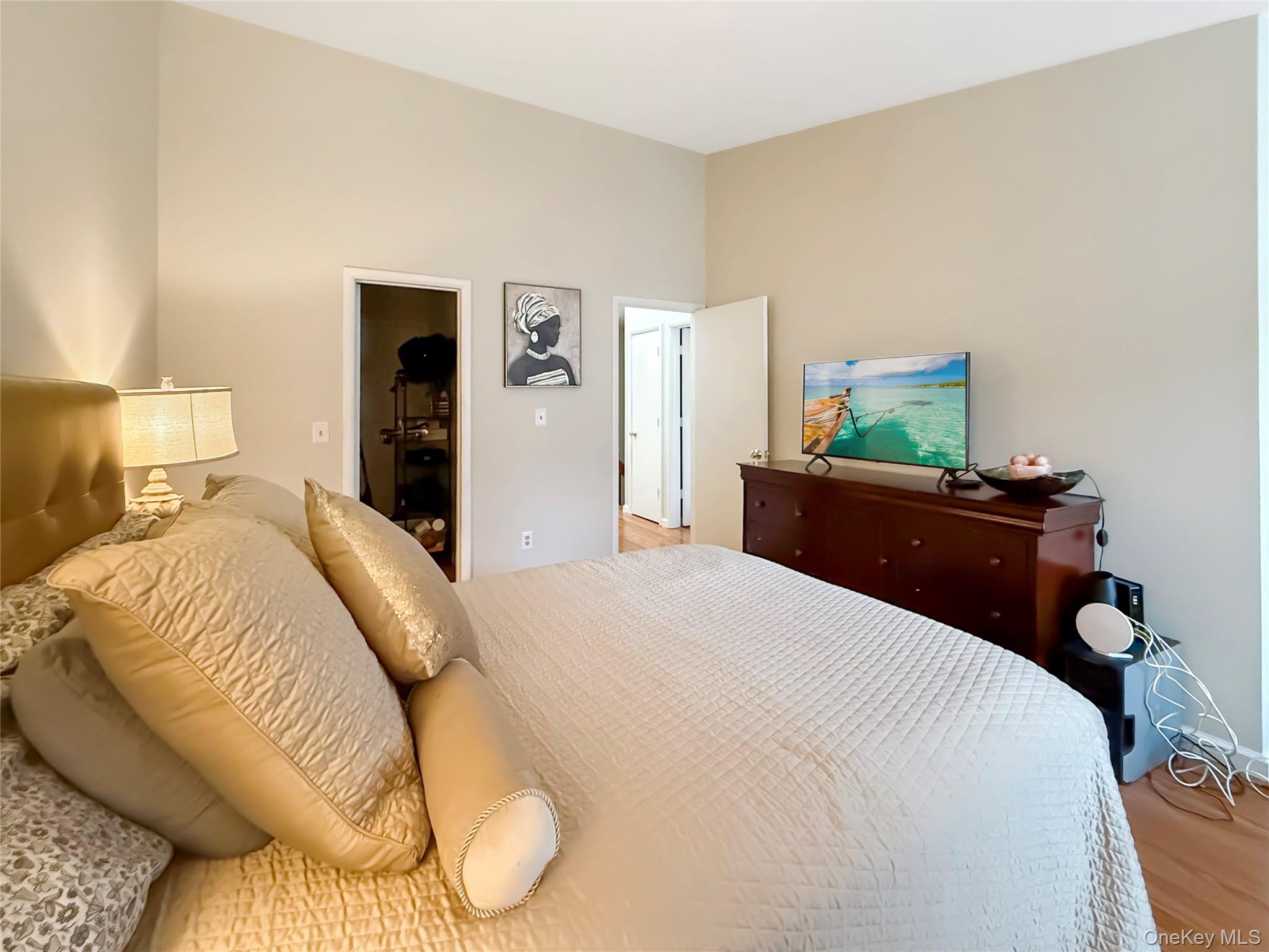 4508 Whispering Hills Road Chester, NY 10918 - Photo 15 of 20 a bedroom with a bed and a lamp