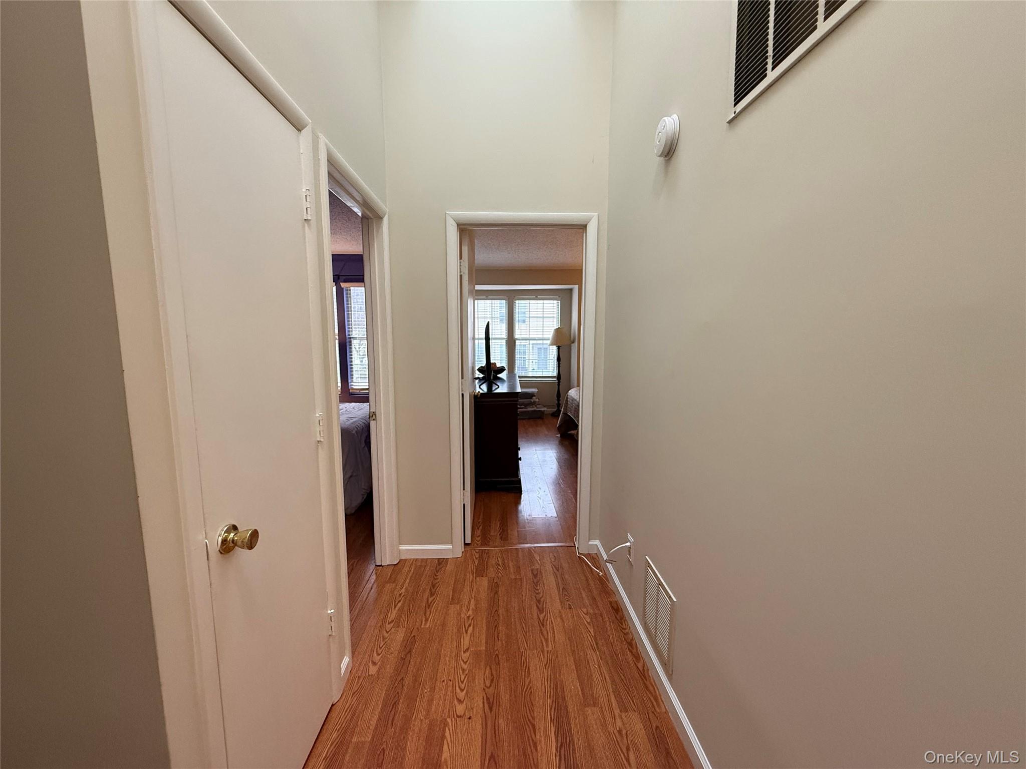 4508 Whispering Hills Road Chester, NY 10918 - Photo 20 of 20 a view of a hallway with wooden floor and a bathroom