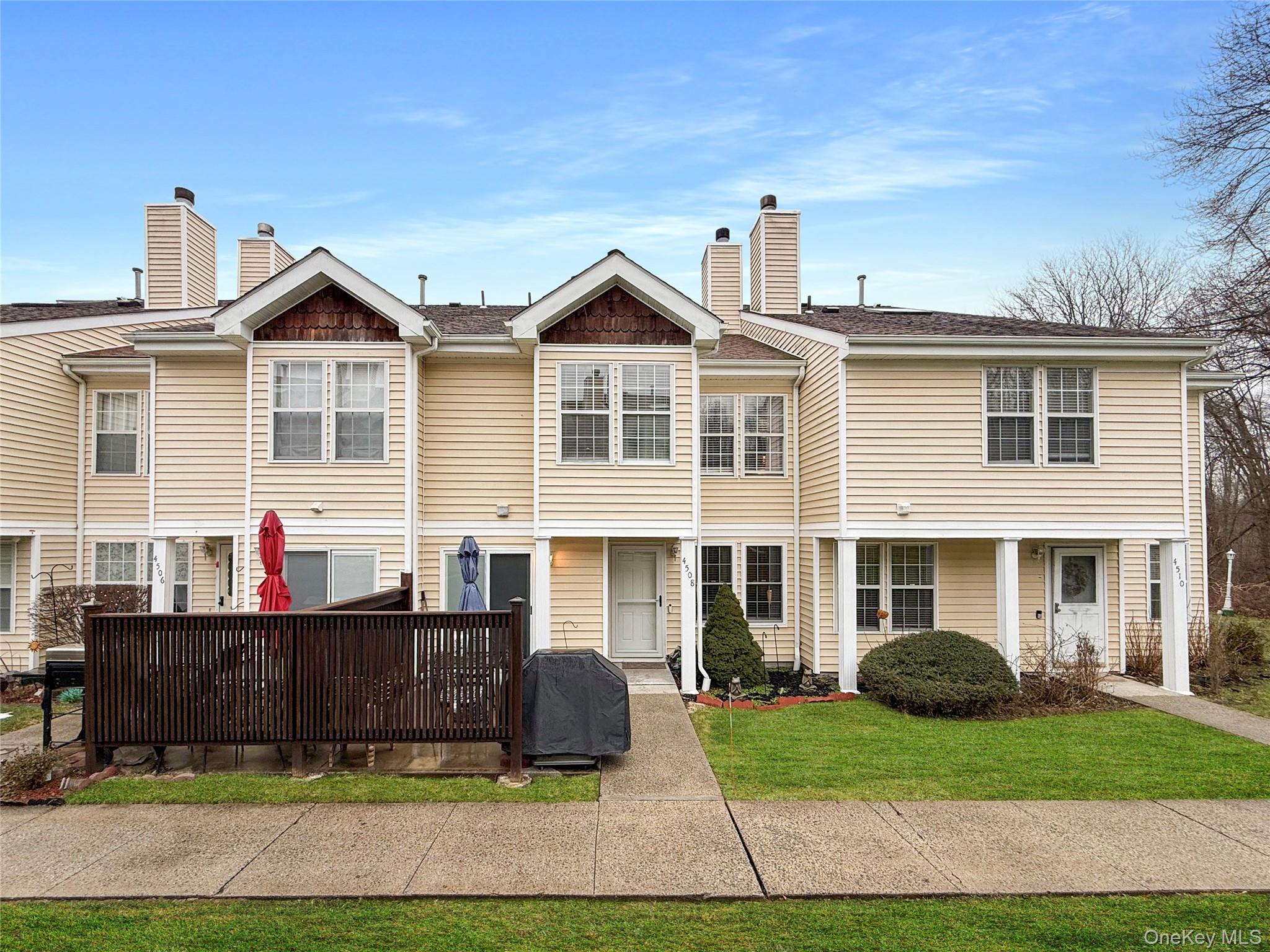 4508 Whispering Hills Road Chester, NY 10918 - Photo 2 of 20 a front view of a house with a yard and outdoor seating