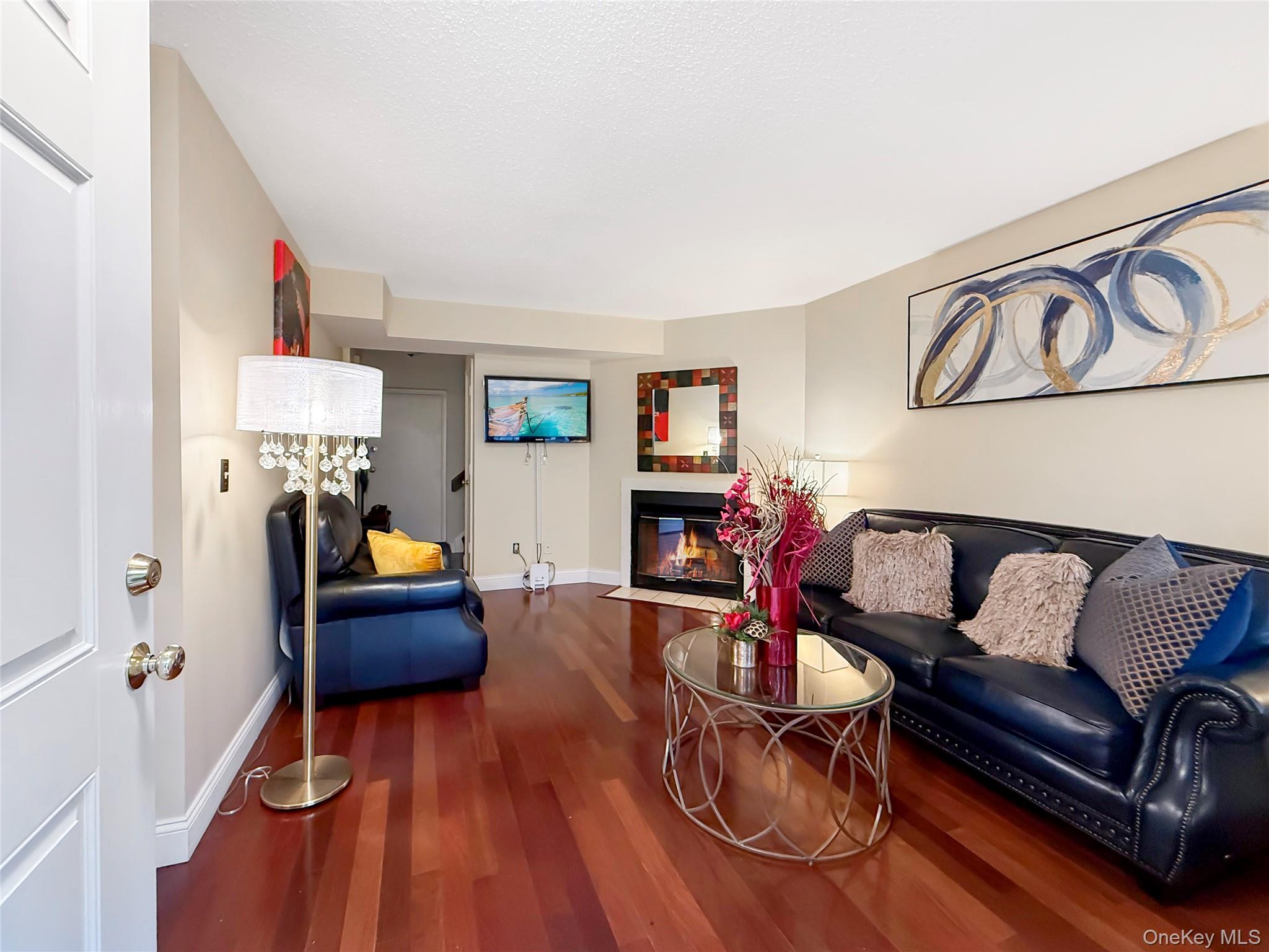 4508 Whispering Hills Road Chester, NY 10918 - Photo 4 of 20 a living room with furniture and a wooden floor