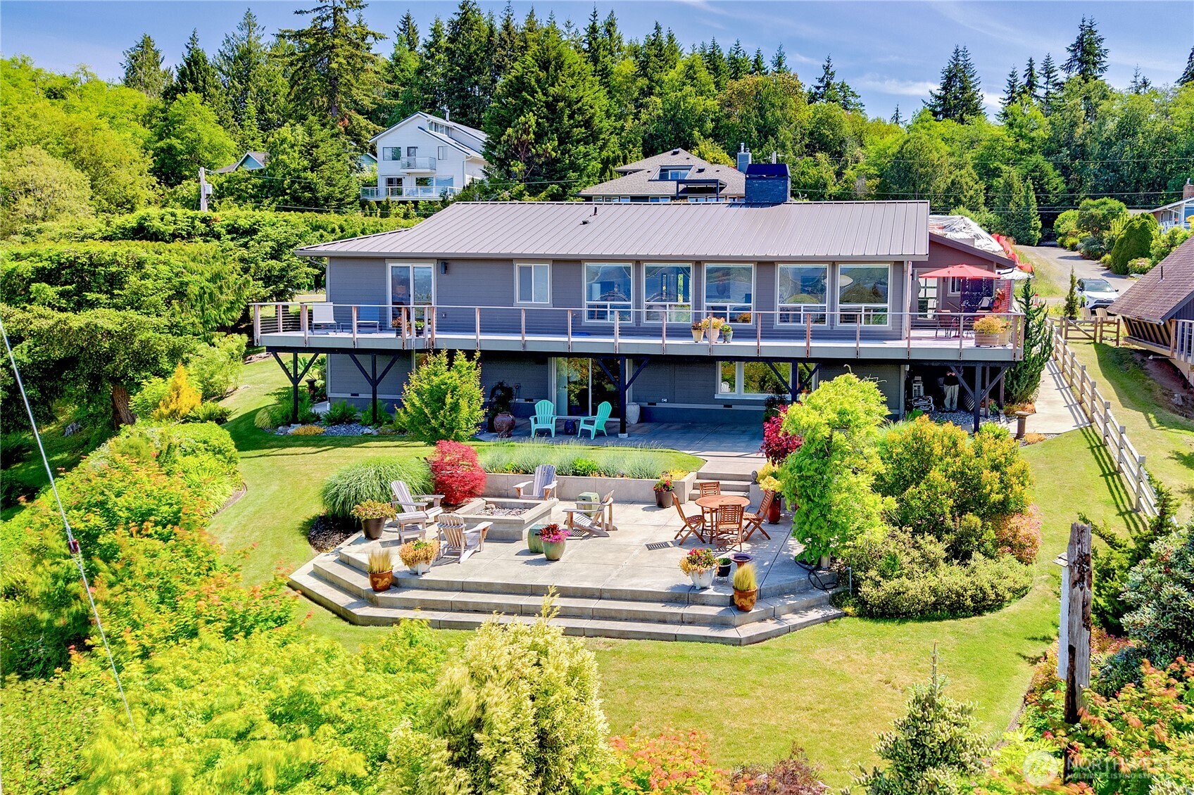 37709 Olympic View Road Northeast Hansville, WA 98340 - Photo 36 of 40 a view of a house with swimming pool and garden
