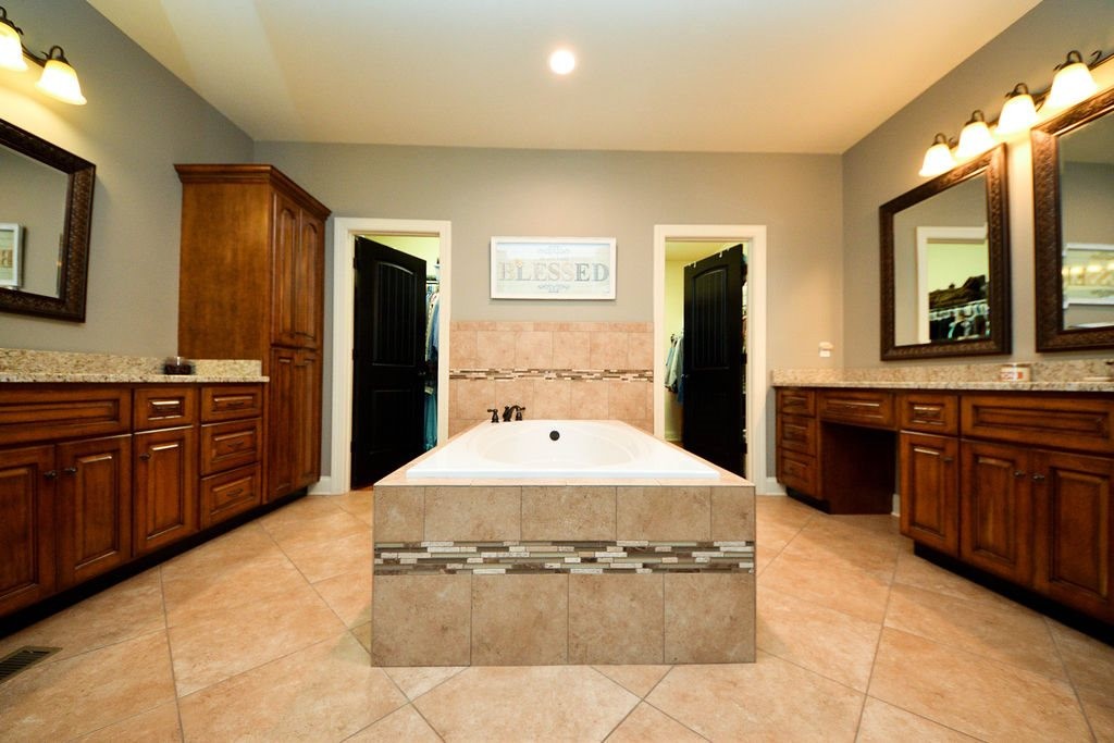 1460 No Pone Road Georgetown, TN 37336 - Photo 19 of 33 a spacious bathroom with a granite countertop sink and a bathtub