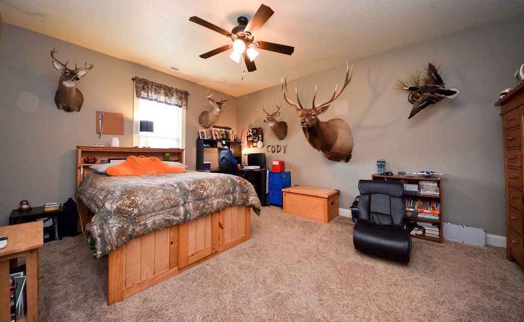 1460 No Pone Road Georgetown, TN 37336 - Photo 23 of 33 a bedroom with a bed dresser and a chandelier
