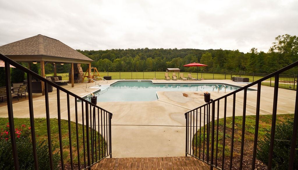 1460 No Pone Road Georgetown, TN 37336 - Photo 28 of 33 a view of a balcony with two chairs and a table