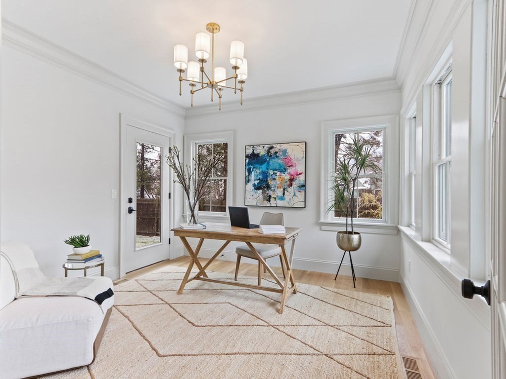 31 Karen Road Newton, MA 02468 - Photo 18 of 41 a living room with patio furniture and a chandelier