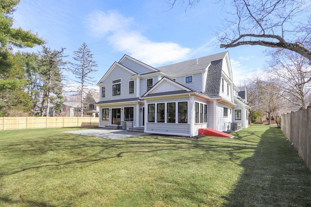 31 Karen Road Newton, MA 02468 - Photo 40 of 41 a front view of a house with a yard table and chairs