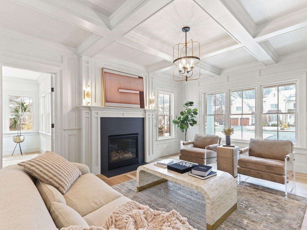 31 Karen Road Newton, MA 02468 - Photo 4 of 41 a living room with furniture a chandelier and a fireplace