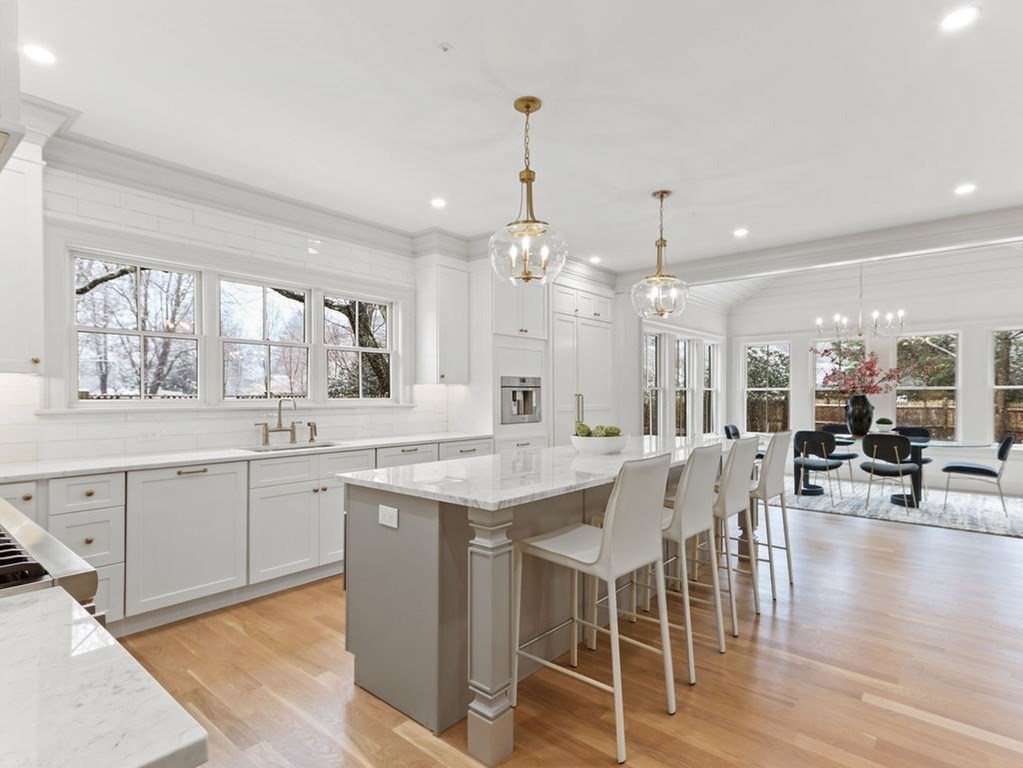 31 Karen Road Newton, MA 02468 - Photo 5 of 41 a kitchen with center island table and chairs