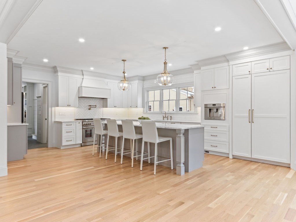 31 Karen Road Newton, MA 02468 - Photo 6 of 41 a large kitchen with a large counter top appliances and cabinets